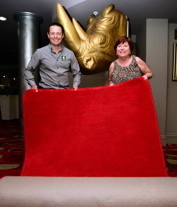 GOLDEN HOPES: Dubbo Chamber of Commerce's president Matt Wright and executive officer Toni Beatty roll out the red carpet for tonight's Rhino awards gala. Photo: Belinda Soole