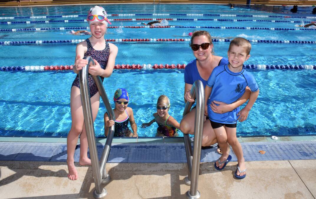FUN IN SUN: Colby Hitchcock, pictured with Ayla, Willow, Tully and Zail Pittock, says her family would use an indoor pool. Photo: BELINDA SOOLE