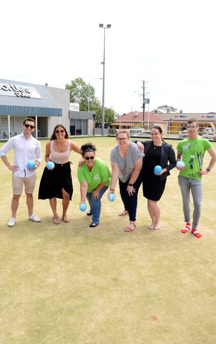 Raising awareness: Aaron Cassidy, Tabcorp's Arely Carrion, Rachel Thomas, Headspace's Ann-Maree Hartley, Sporties GM Shae Hutchins and Headspace's Nic Steepe. Photo: BELINDA SOOLE