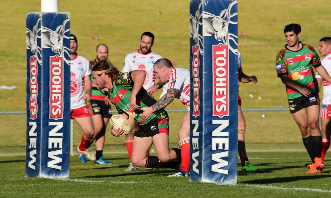 He's over: Westside prop Tye Blanchett goes over for a try during the match against Narromine on Sunday. Photo: BELINDA SOOLE
