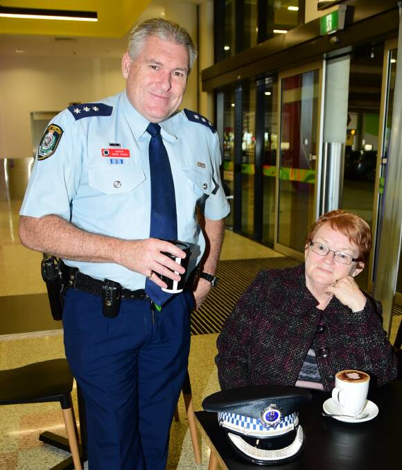 CHATTING: Inspector Mark Dixon with Sandra West at the Coffee With A Cop promotion at Coffee Club on Thursday. Photo: BELINDA SOOLE