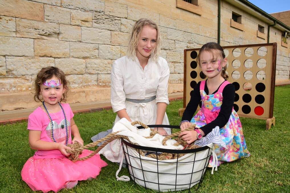 Play: Old Dubbo Gaol's Sally Rowlands (centre) as prisoner 'Tilly' entertains sisters Estelle and Summer-Lee Taylor. Photo: BELINDA SOOLE.
