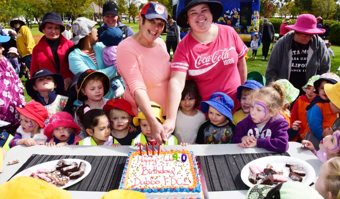 Milestone: Margaret Bernie and Leeana Lewis cutting the cake at the 40th birthday celebrations for Dubbo Family Day Care. Photo: Belinda Soole