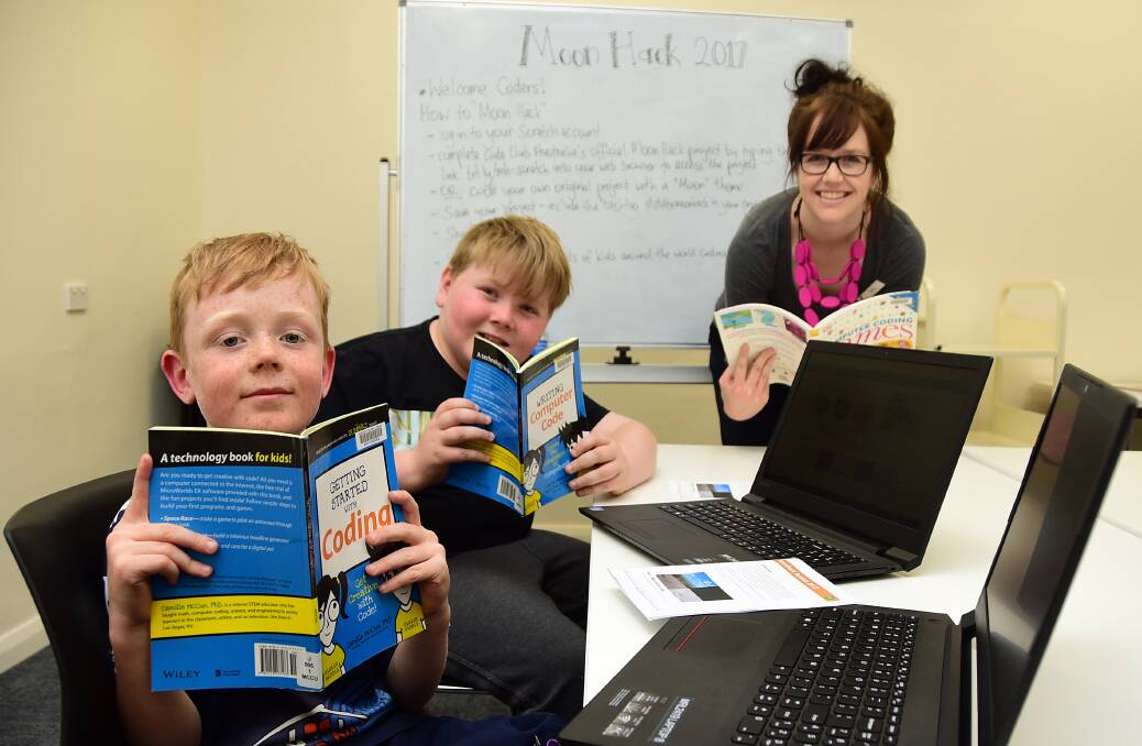 CODING WHIZZ KIDS: Eight-year-old Darcy O'Leary and ten-year-old Billy Milton attempted the record with Sarah Tilbrook. Photo: BELINDA SOOLE