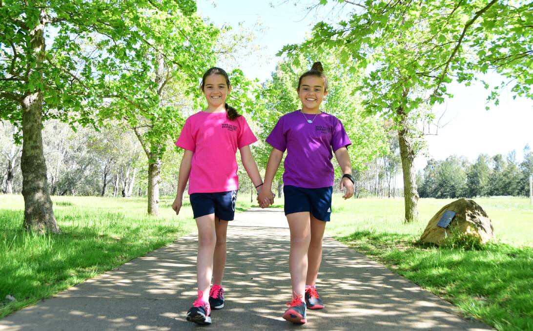 WALKING TOGETHER: Madison and Ashleigh Young will walk five kilometres on Sunday for type 1 diabetes research, after Ashleigh was diagnosed with the disease five years ago. Photo: BELINDA SOOLE