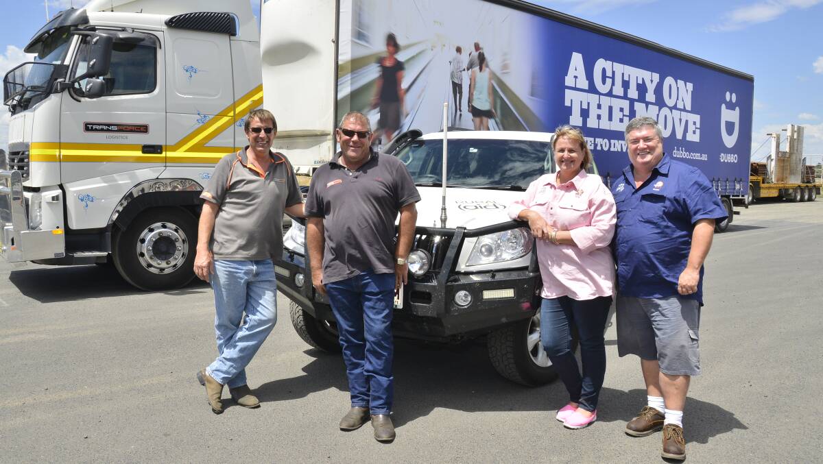 PITCHING IN: Tranforce Logistics storage distribution manager James Josephs and line haul manager Mark Gillespie with Rural Aid's Tracy and Charles Alder. Photo: BELINDA SOOLE