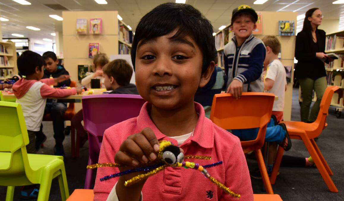 Holiday fun: Ronan Narayan at the wild themed arts and crafts school holiday workshop hosted by the Dubbo Library. Photo: Paige Williams