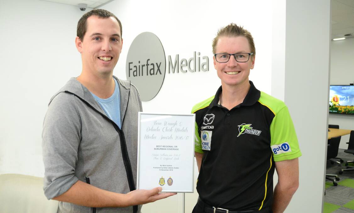 AWARD: Daily Liberal sports reporter Nick Guthrie accepts his award from Matt Ellis. Photo: BELINDA SOOLE