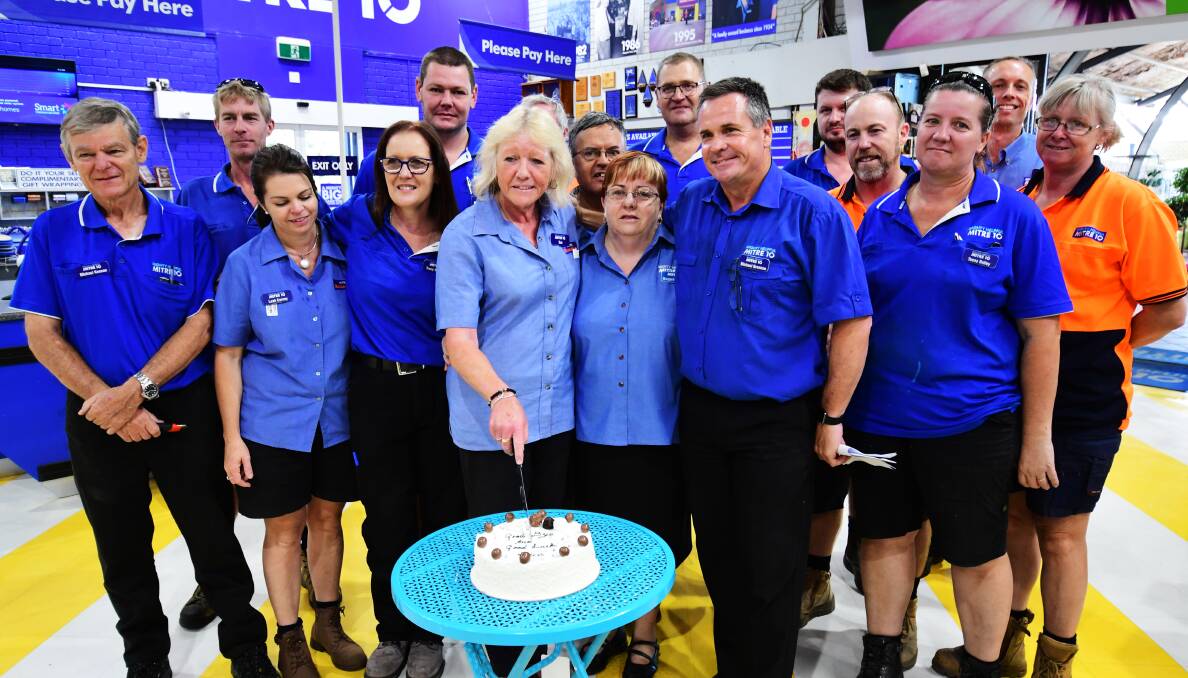 Sue Henry with her Mitre 10 family. Photo: BELINDA SOOLE