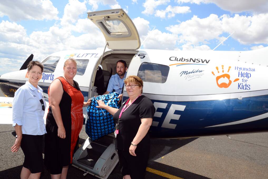 Little Wings business development manager Claudia Steiner, pilot Adam Holt, Amy Cubby and Leanne Thuell, Burnside Western Family Referral Service. Photo: Belinda Soole