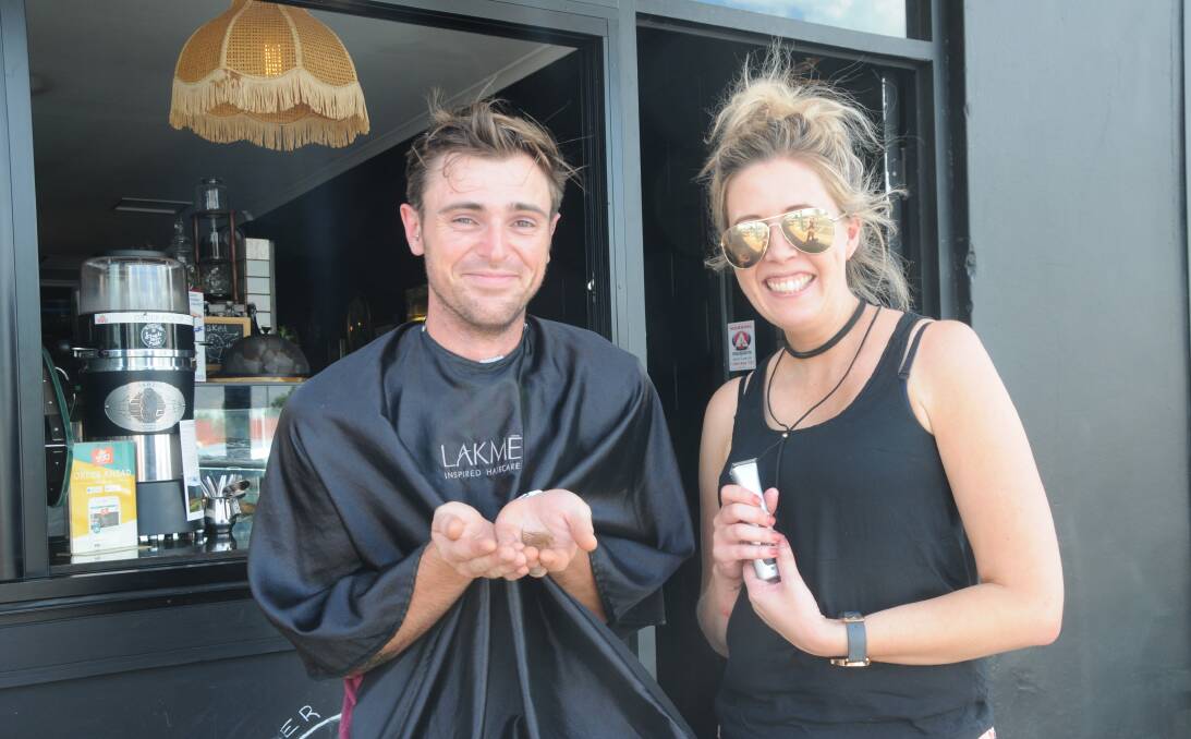 All gone: Dubbo local and Black Tambourine owner Ben Cluff with hairdresser Suzy Kershaw from Tease and Co. after his moustache was shaved off. Photo: Taylor Jurd 