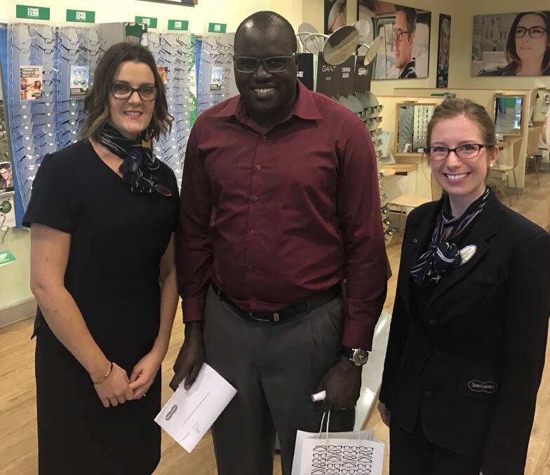Future is clear: Specsavers Dubbo retail and dispensing director Claire Curtin and Optometrist Yvonne O'Sullivan with LCFU founder Moses Goire. Photo: Contributed