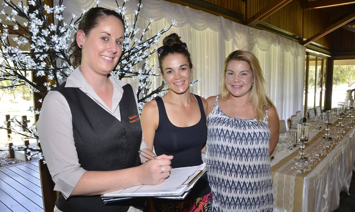 I do: Eryn Fraser and Eloise Fraser getting all of the latest wedding information that the Dubbo Zoo has to offer from Hospitality Coordinator Jodie McQuillan. Photo: Paige Williams 