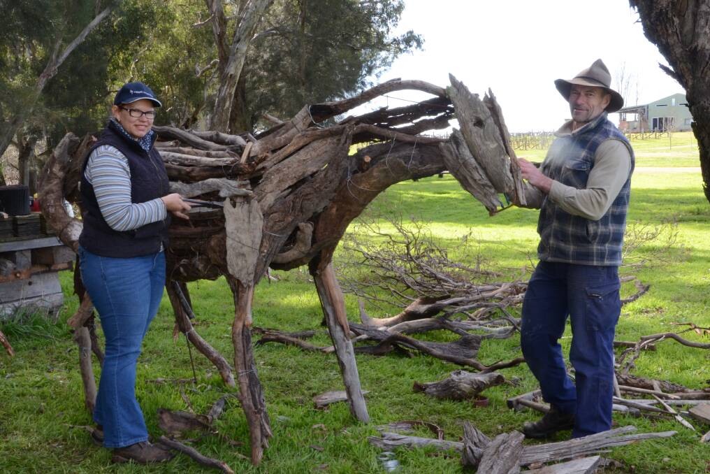 Masterclass: Belinda Nugent putting together her stick horse sculpture, next to her is Wongarbon artist Brett Garling who was on hand to offer his expertise to participants at the Lazy River workshop. Photo: Taylor Jurd