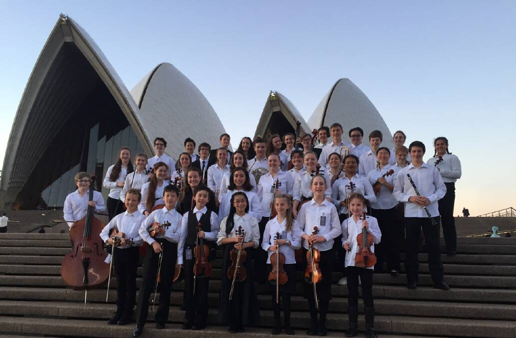 YOUNG AND TALENTED: The Regional Youth Orchestra NSW comes together on the steps of the Opera House in Sydney. Photo: Contributed.