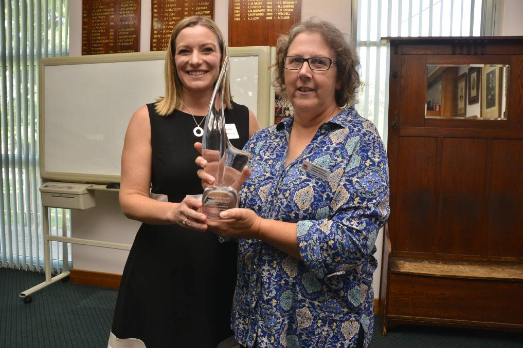MAJOR AWARD: The Studer Group's Michele Dobe presents Dubbo Hospital general manager Debbie Bickerton with the Studer Group Australian Healthcare Organisation of Distinction award. Photo: PAIGE WILLIAMS