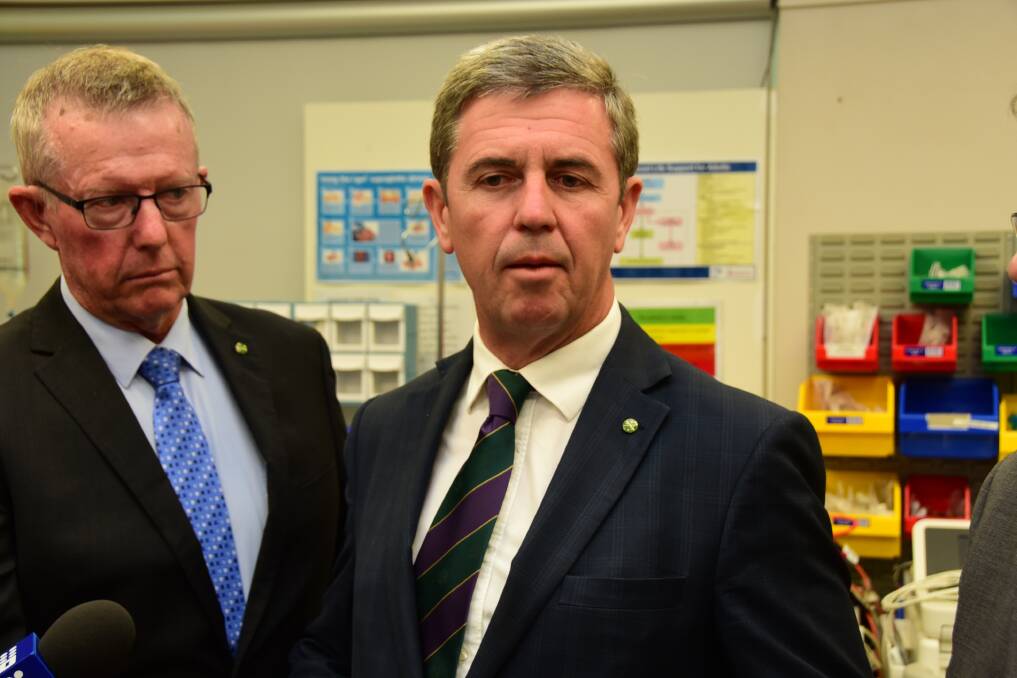 NATIONAL ANNOUNCEMENT: Federal Assistant Minister for Health Dr David Gillespie announces 26 training hubs for regional Australia in Dubbo on Thursday, watched by federal Member for Parkes Mark Coulton (left) . Photo: PAIGE WILLIAMS