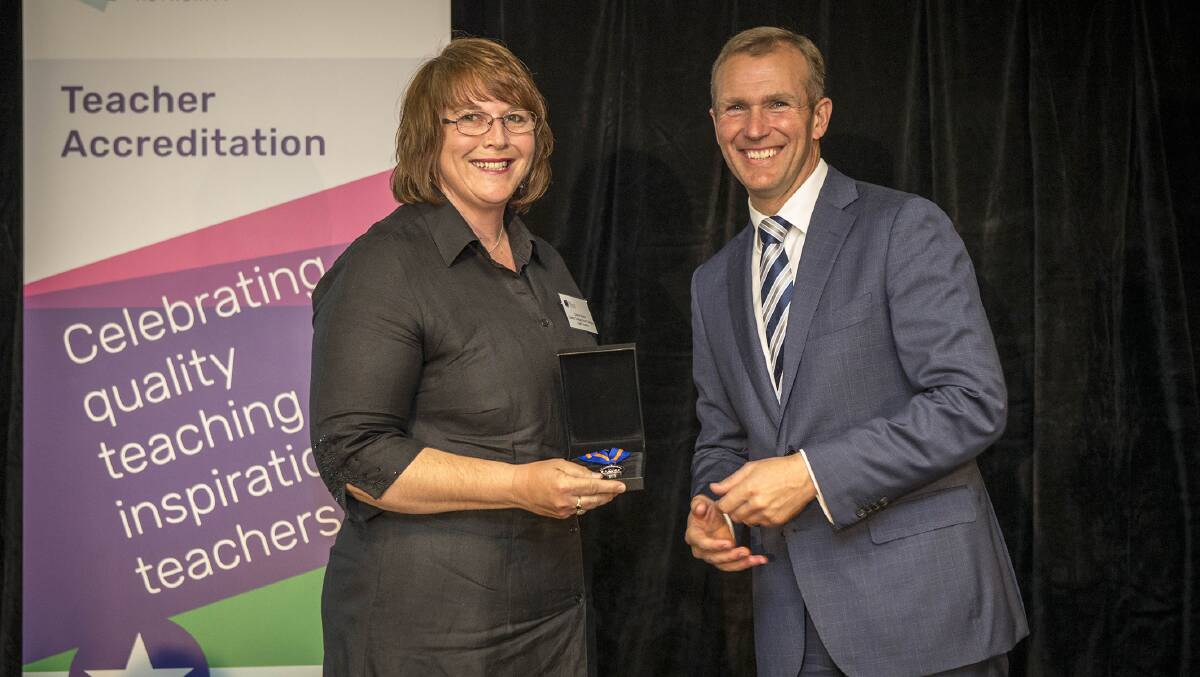 NEW TITLE: NSW Education Minister Rob Stokes presents Dubbo College deputy principal Di Baker with her accreditation as a lead teacher. Photo: Contributed.