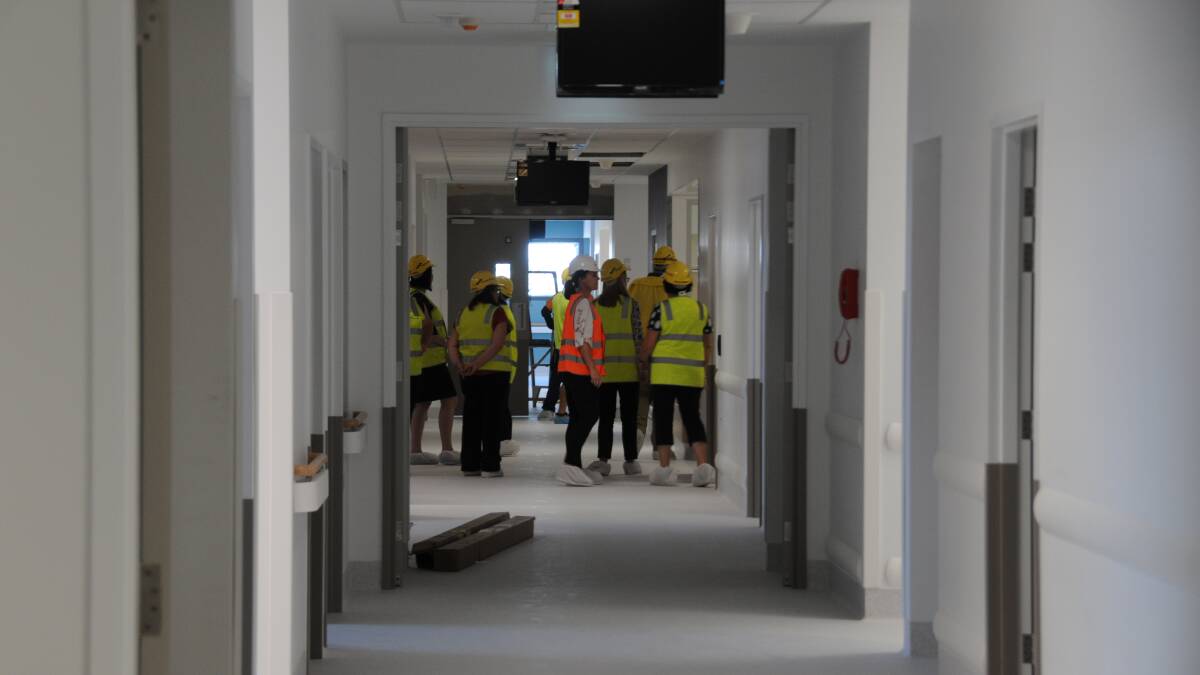TOUR: Members of Dubbo Hospital's team of executives tour its new surgical inpatient unit on Tuesday. Photo: PAIGE WILLIAMS.