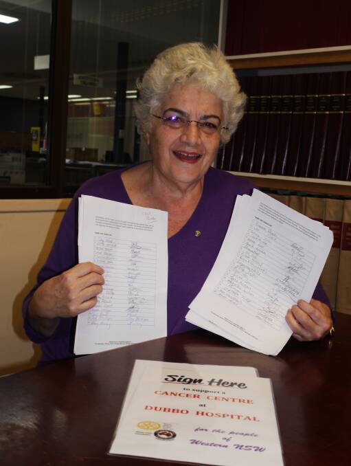 PETITION RECALL: Rotary Club of Dubbo West's Lyn Smith holds some of the petition sheets already returned for presentation to the Federal Parliament. Photo: KIM BARTLEY