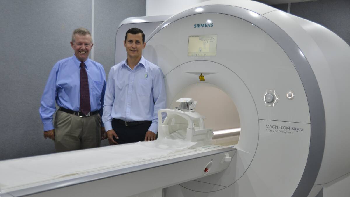 $2M MACHINE: Orana Radiology practice manager Jonathan Lowe shows federal Member for Parkes Mark Coulton the new MRI machine. Photo: PAIGE WILLIAMS  