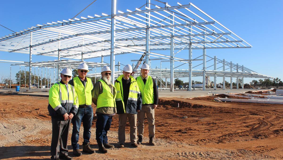 CONSTRUCTION SITE: Federal Member for Parkes Mark Coulton (second from right) inspects the construction site of the new small stock abattoir 14 kilometres north of Bourke. Photo: Contributed