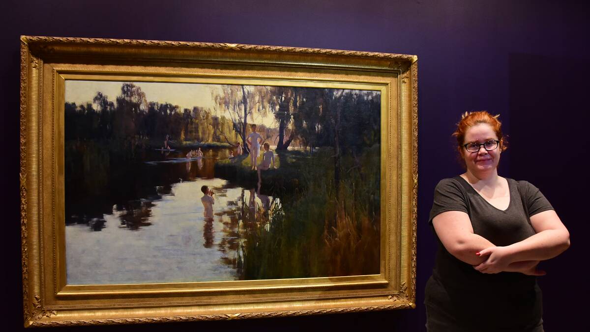 SEMINAL WORKS: Jess Moore admires ‘By tranquil waters’ painted by Sydney Long in  1894. It is part of a new exhibition opening at Western Plains Cultural Centre on Saturday. Photo: BELINDA SOOLE  