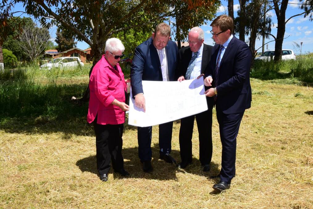 LAND:  Lorna White, Rod Crowfoot, Michael Kneipp and Troy Grant inspect plans for Macquarie Home Stay after 3.5 hectares of Crown land were aquired for its construction.. Photo: BELINDA SOOLE
