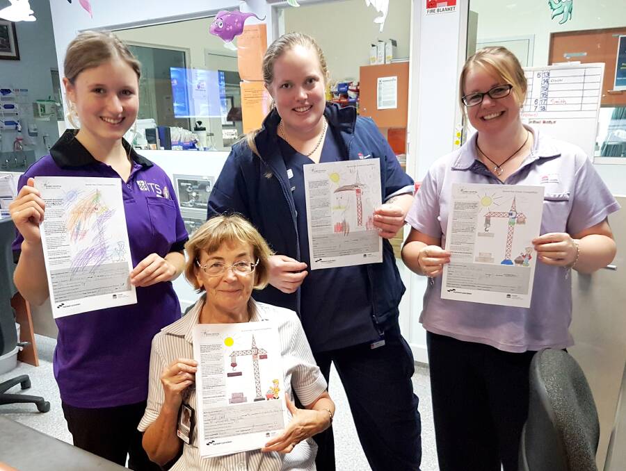 40 ENTRIES: Entries in the name the crane competition are admired by Dubbo Hospital nursing student Jess Parker, paediatric nurse unit manager Deanne Dent, endorsed enrolled nurse Cirace May and ward clerk Lexey Smith. 