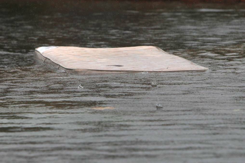 A matress floating along Beach Street, Wollongong. Photo: Sylvia Liber