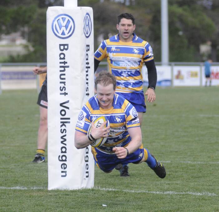 LEAPING TO VICOTRY: Phil Tonkin dives over for the Bulldogs' final try in his side's 42-17 Blowes Clothing Cup win against CSU at Ashwood Park on Saturday. Photo: CHRIS SEABROOK 082016cbdogs11b