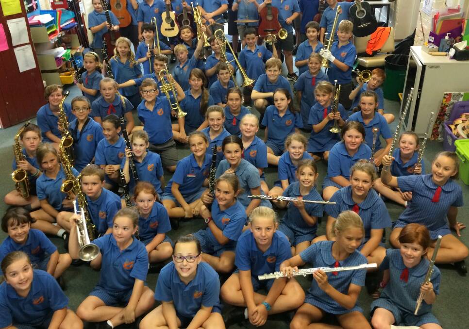 Happy musicians: Macquarie Conservatorium’s instrumental students are excited for their lessons at Dubbo Public School.