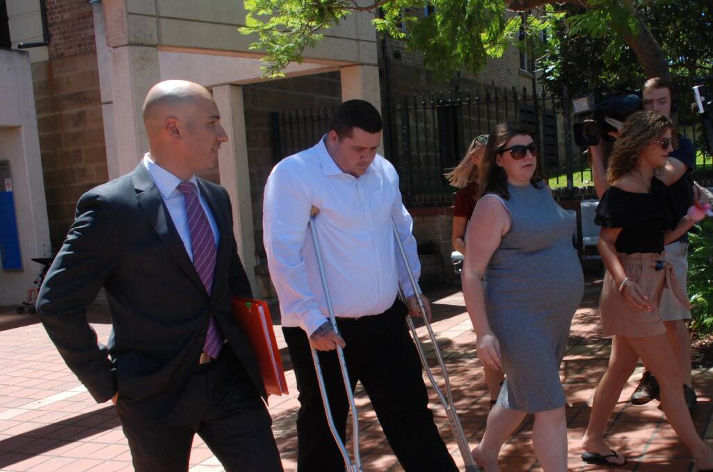 An injured Jackson George, flanked by lawyer Ali Abbas and family members, departs Campbelltown courthouse Tuesday morning. Picture: Angela Thompson