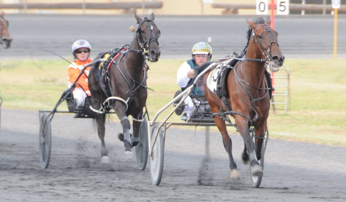 ON A ROLL: James Sutton (right) guided Kimsarme Direct to victory last time they paired up at Dubbo Paceway. Photo: NICK GUTHRIE