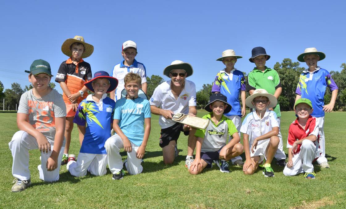 CLASSY COACH: Former Australian cricketer John Dyson and some of the many local juniors at the clinic on Wednesday. Photo: BELINDA SOOLE