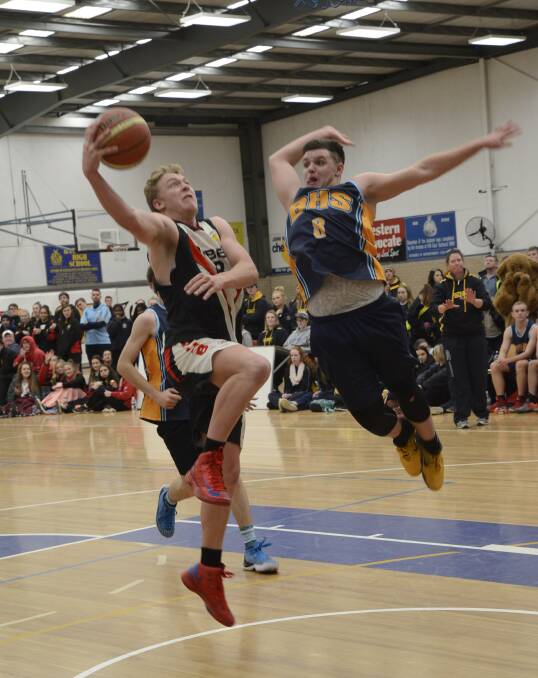 To the hole: Dubbo College's Luke Gale drives towards the hoop during the Astley Cup basketball match against Bathurst High. Photo: Phill Murray