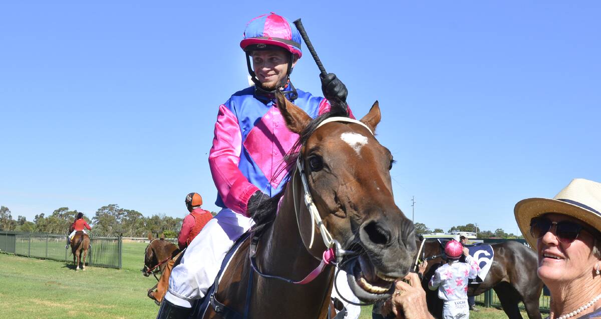 HAPPY TIMES: Jockey Jake Pracey-Holmes and Stoneyrise were all smiles after last year's win at Dubbo. Photo: BELINDA SOOLE
