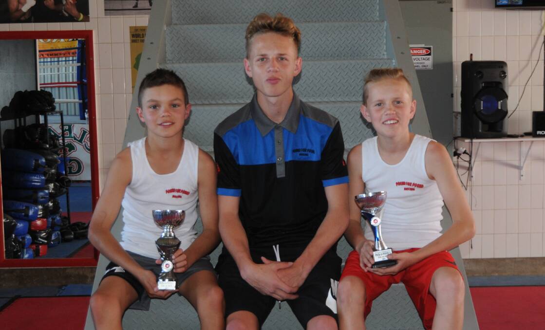 TALENT: Rome Toomey (left), John Hill Jnr and Dasher Hill all won bouts in Tasmania on the weekend. Photo: NICK GUTHRIE