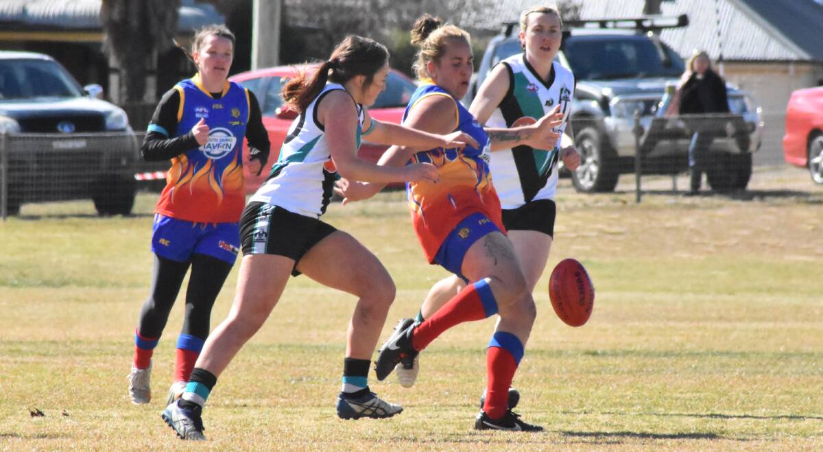 CLEAR IT: Chelsea Flanders puts boot to ball for the Demons at Bathurst on Saturday. Photo: SHARON STEVENS