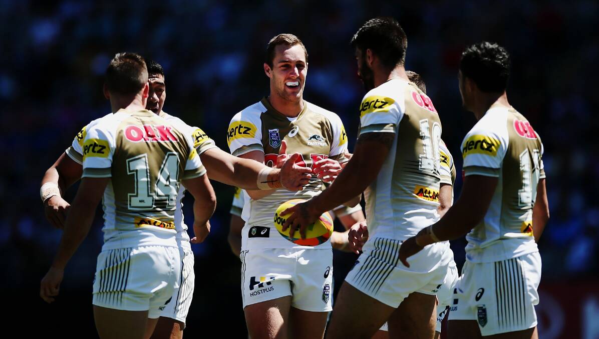 SUCCESSFUL RUN: Isaah Yeo (centre) celebrates with teammates during Penrith's run to the final of the Auckland Nines. Photo: GETTY IMAGES