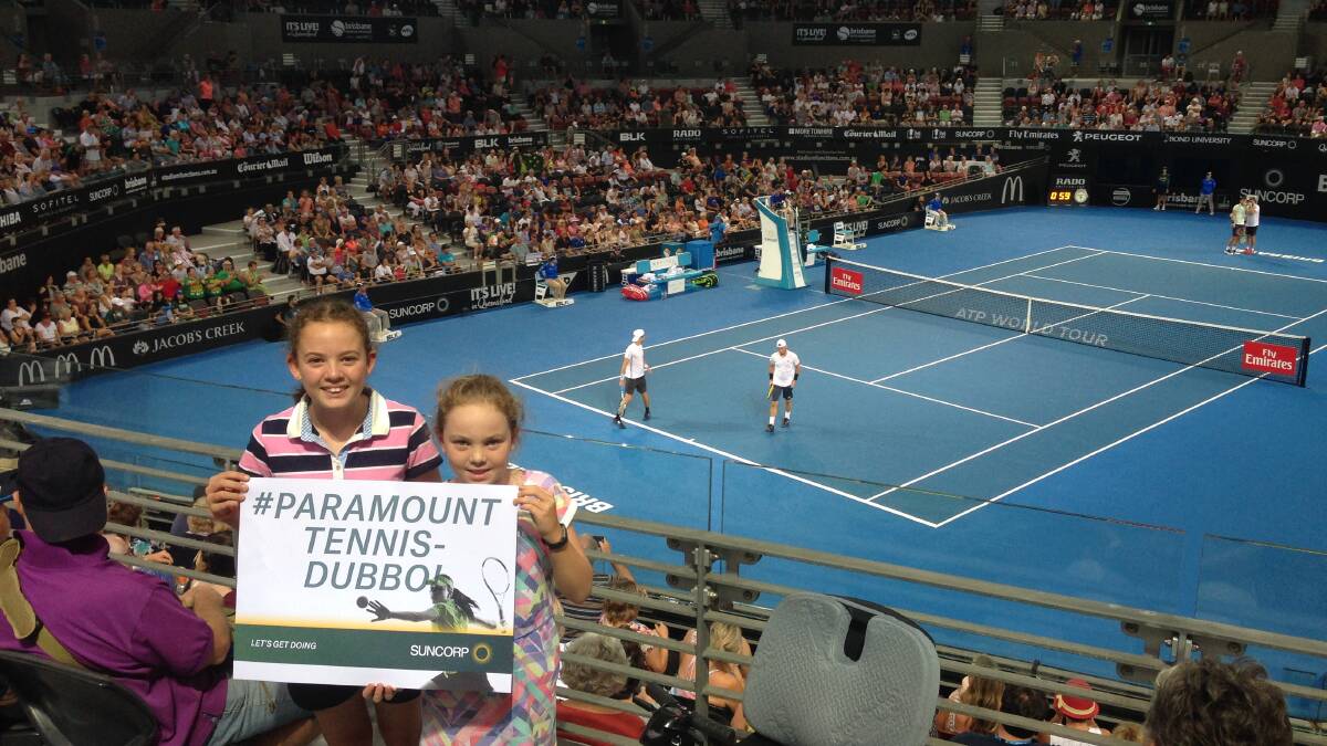 FUN: Dubbo's Molly and Amy Quilty were cheering on Lleyton Hewitt and Jordan Thompson at Brisbane.
