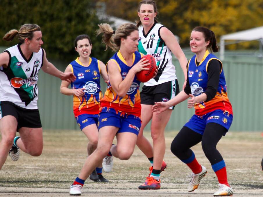 STELLAR DEBUT: Emily Warner (centre) has been named best and fairest for the Central West AFL Women's 2017 season. Photo: JO IVEY