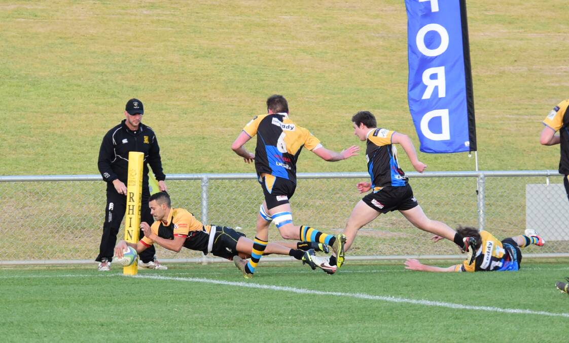 Try time: Rhinos fullback Rickey Weatherall scores a vital five-pointer in the corner during his side's thrilling win over CSU. Photo: BELINDA SOOLE