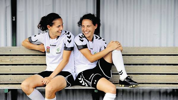 SISTER'S JOURNEY: Nicole and Ash together during the early days of Canberra United and the W-League. Photo: CANBERRA TIMES