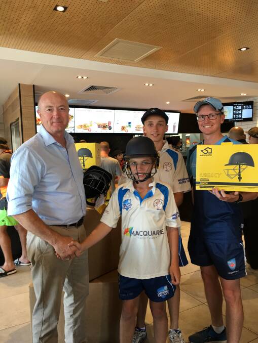 DONATION: Dubbo McDonald's licensee Gary Barraclough, junior cricketers Paddy Nelson (front) and Tom Coady, and Cricket NSW Development Officer Matt Ellis.
