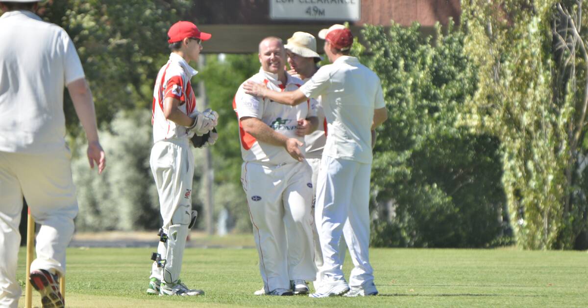 WICKETS: RSL-Colts players congratulate Shane Groen, who finished with 3/23 on Saturday as the RSL-Pinnington Cup's top side extended its lead at the top of the ladder by one more point. Photo: BELINDA SOOLE