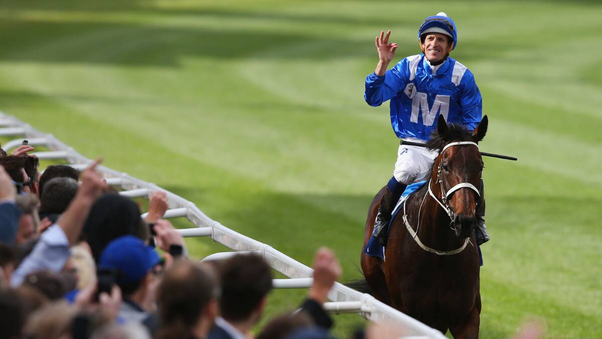 SHE'S APPLES: Hugh Bowman celebrates after guiding Winx to one of his many memorable victories. Photo: GETTY IMAGES