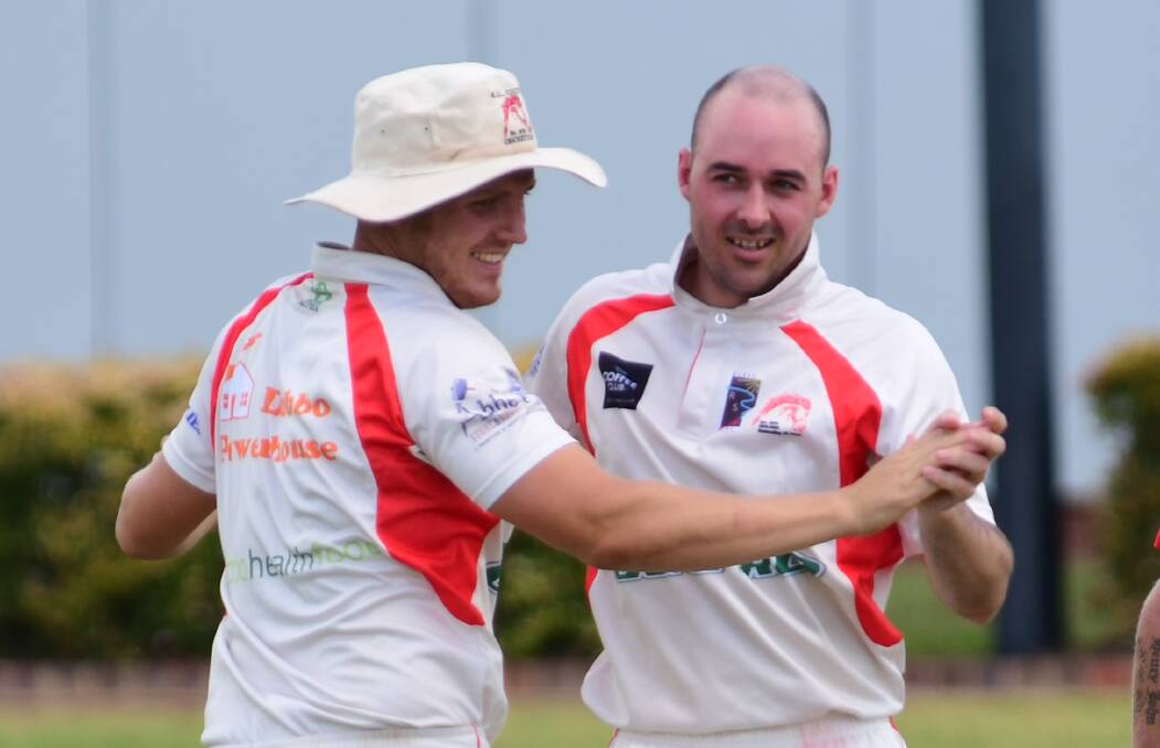 ALL TOO EASY: RSL-Colts captain Greg Buckley (left) celebrates a wicket with left-armer Bede Young, who was a standout on Saturday and claimed 4/20 while bowling his nine overs straight in the heat. Photo: BELINDA SOOLE