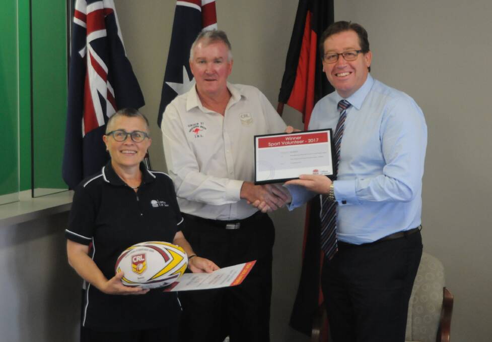 HARD WORKING: Neil Millgate (centre) with NSW Sport and Recreation's Kris Stevens and Dubbo MP Troy Grant. Photo: NICK GUTHRIE