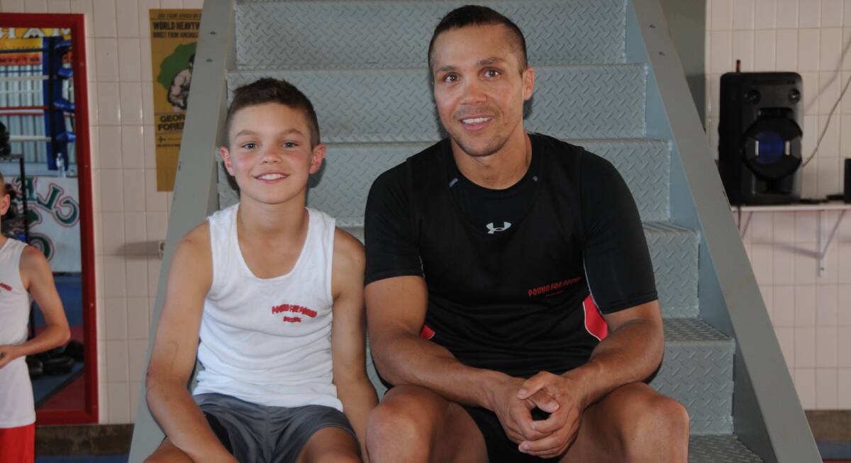 BUSY: It's been a massive year for Pound For Pound trainer Robert 'Gummy' Toomey, pictured with son Rome.